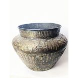 A large Egyptian brass pot, H.34cm