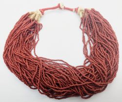 An Indian or Burmese red glass bead Naga necklace, circa 20th century,