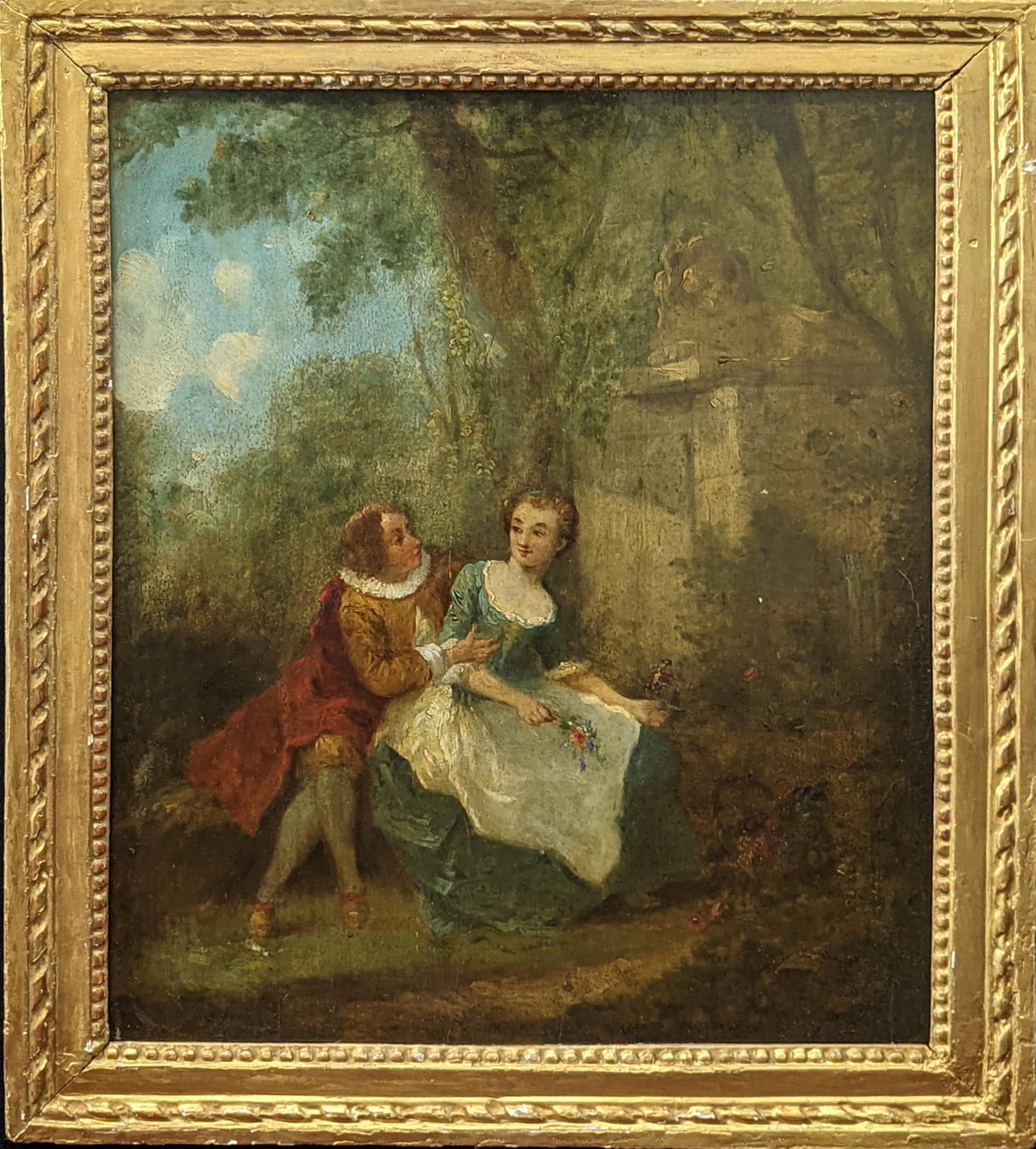 18th century French School, two lovers in a garden, oil on board, inscription on label to verso, H.