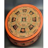 A 19th century Burmese circular red lacquer pickled tea leaf box for Lahpet ingredients, with Zodiac