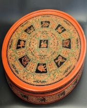 A 19th century Burmese circular red lacquer pickled tea leaf box for Lahpet ingredients, with Zodiac