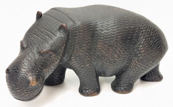 An African tribal carved ebony hippo