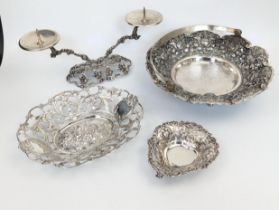 A collection of silver tableware to include and German silver dish, a Malaysian swing handle dish, a