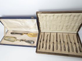 A Continental silver handled serving fork and slicer, together with a Continental silver handled set