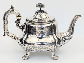 A late 19th century French silver teapot, screw in floral finial, vacant cartouche, marks to the