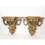 A pair of gilt wall sconces, H.36cm W.40.5cm