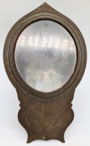 A 19th century Indian or Sri Lankan brass mirror engraved with parrot motifs, H.25cm