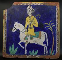 A very unusual large 19th century North Indian multan glazed pottery tile depicting a horse and