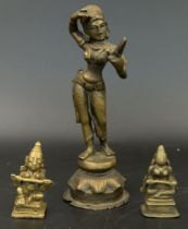 A 19th century Indian bronze figure of a dancer and two other small bronze figures, H.15cm and H.