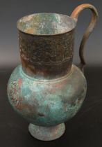A fine 12-13th century Persian Seljuk bronze jug with large Kufic calligraphy around the top, H.16.