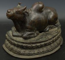 A fine 16-17th century South Indian or Nepalese bronze Nandi bull, H.12cm L.18cm