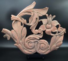 A fine large 17th century Mughal Indian carved red stone fragment depicting floral design, on a