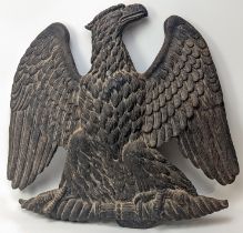 A large cast iron eagle plaque, H.46cm W.49cm