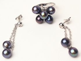 An 18ct white gold and black pearl ring, mounted with 2 small diamonds, together with matching