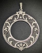 An 18ct white gold circular pendant, filigree work mounted with small diamonds, 13.5g, D.4cm