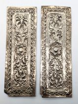 A pair of 19th century Malay silver pillow ends, L.16cm