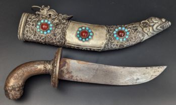 A Sino-Tibetan white metal mounted dagger set with turquoise and agate, Tibet or China, L.33cm