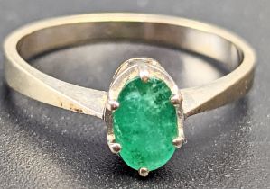 A Continental White gold and Emerald ring approx.0.52cts, 2.4g, size O