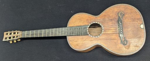 A 19th century guitar, possibly a Rene Lacote, inlaid with mother of pearl, with contemporary hard
