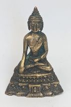 A Tibetan or Chinese brass Buddha, H.6cm