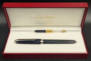 A Cartier Dandy fountain pen, black resin ribbed outer, silver plated accents, date engraving to