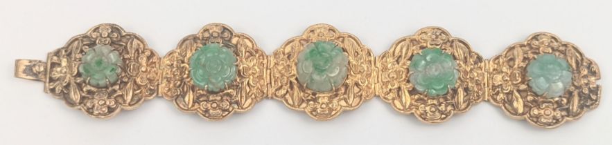A 19th century Chinese gilded silver bracelet inset with jade stones, marked silver to interior,
