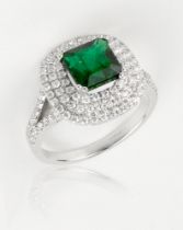 An emerald and diamond ring, square cut 1.96cts Zambian, surrounded by VS diamonds approx.0.79cts