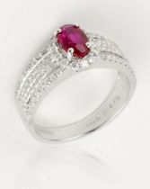 A ruby and diamond ring, 1.01cts unheated Burmese oval cut, mounted on an 18ct white gold band