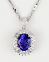A tanzanite pendant, 3.43cts, surrounded with VS diamonds 0.73cts combined, mounted on 18ct white