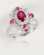 A ruby and diamond ring, oval cut ruby 1.19cts Mozambique unheated, surrounded by 4 smaller rubies