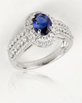 A sapphire and diamond ring, 1.65cts oval cut natural Sri Lankan, mounted with small VS diamonds