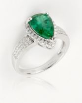 An emerald and diamond ring, 2.81cts pear cut, mounted on 18ct white gold with VS diamonds approx.