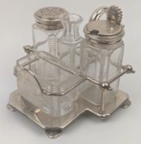 An early 20th century silver and glass cruet set by Goldsmiths, hallmarked London, 1903, silver