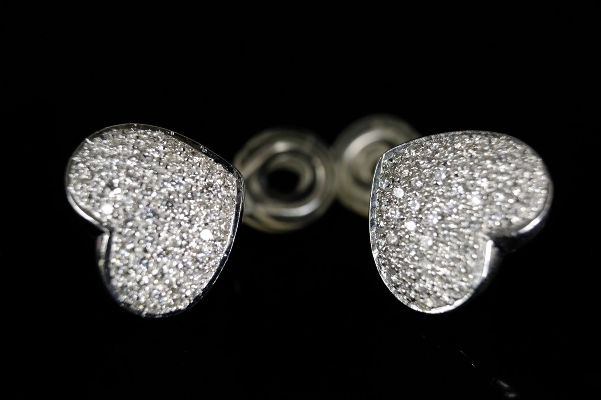 PAIR OF BRILLIANT HEART EARPLACES, each set with just under 60 brilliant-cut diamonds, around 1ct, 