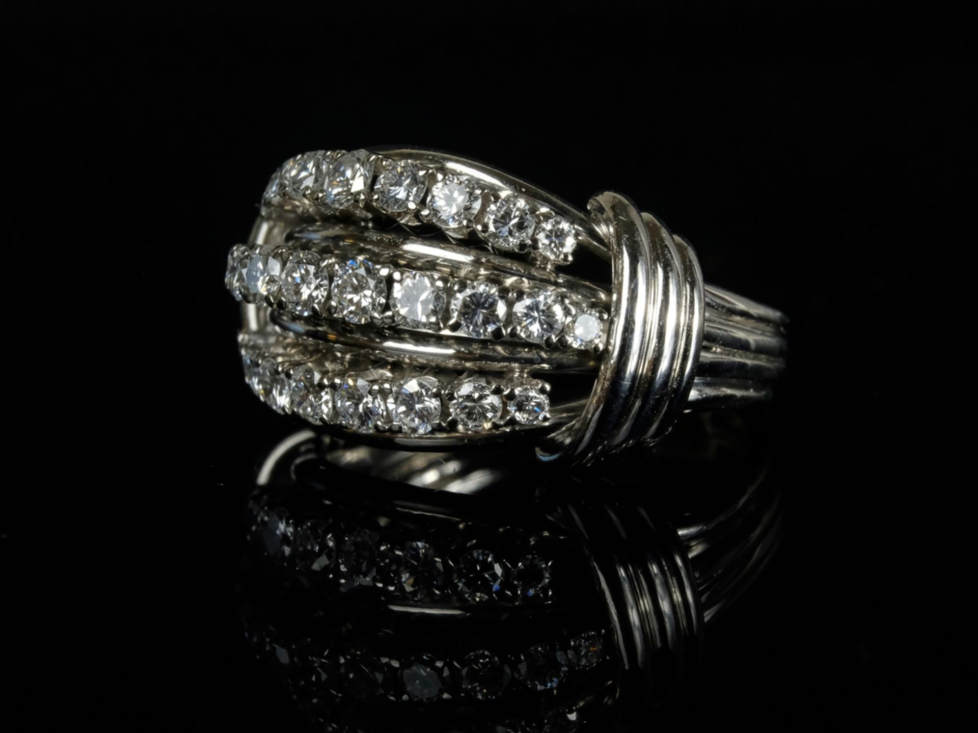 DIAMOND RING face set with three rows of nine diamonds each and eleven in the centre, around 1.00ct