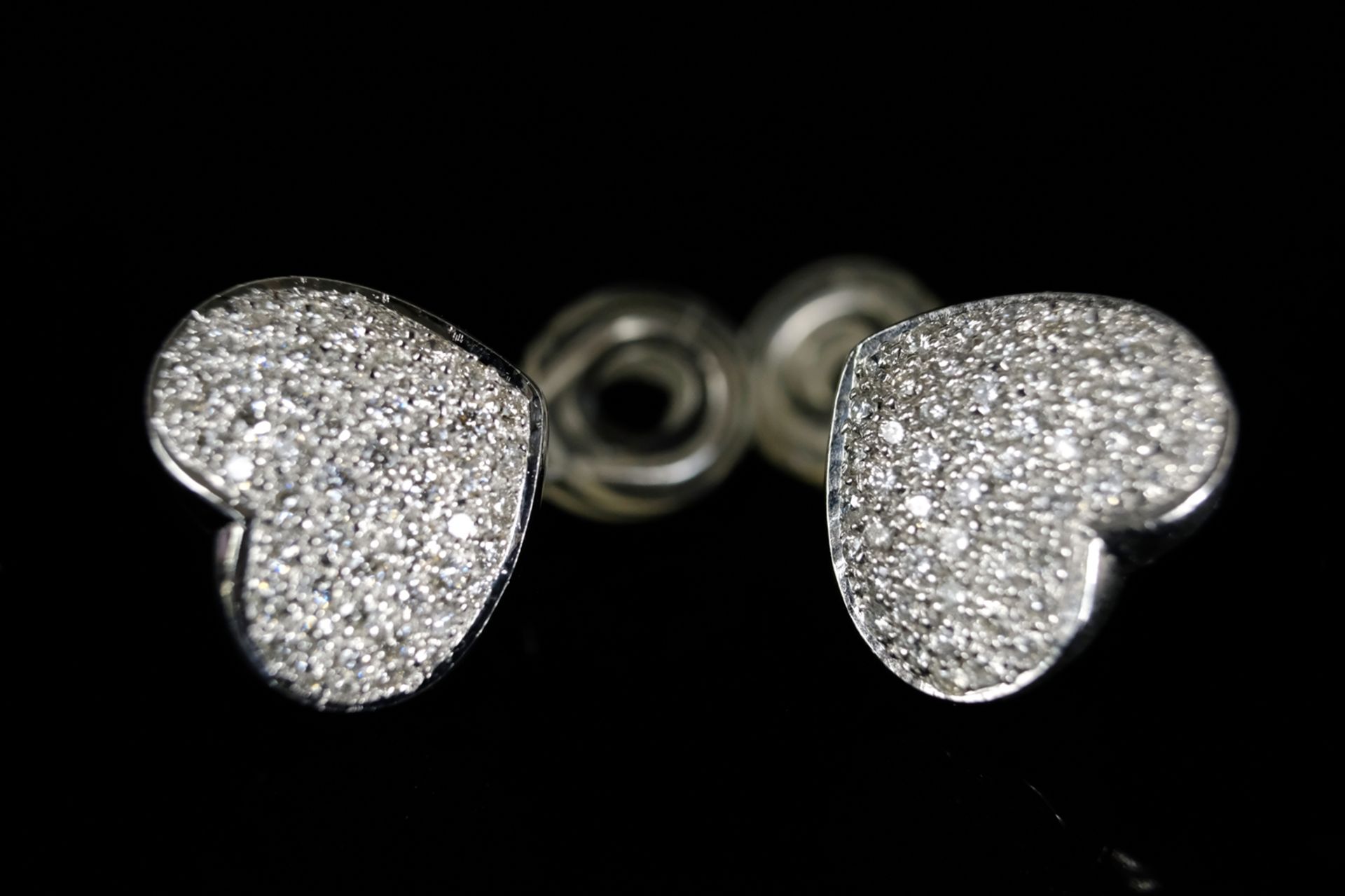 PAIR OF BRILLIANT HEART EARPLACES, each set with just under 60 brilliant-cut diamonds, around 1ct,