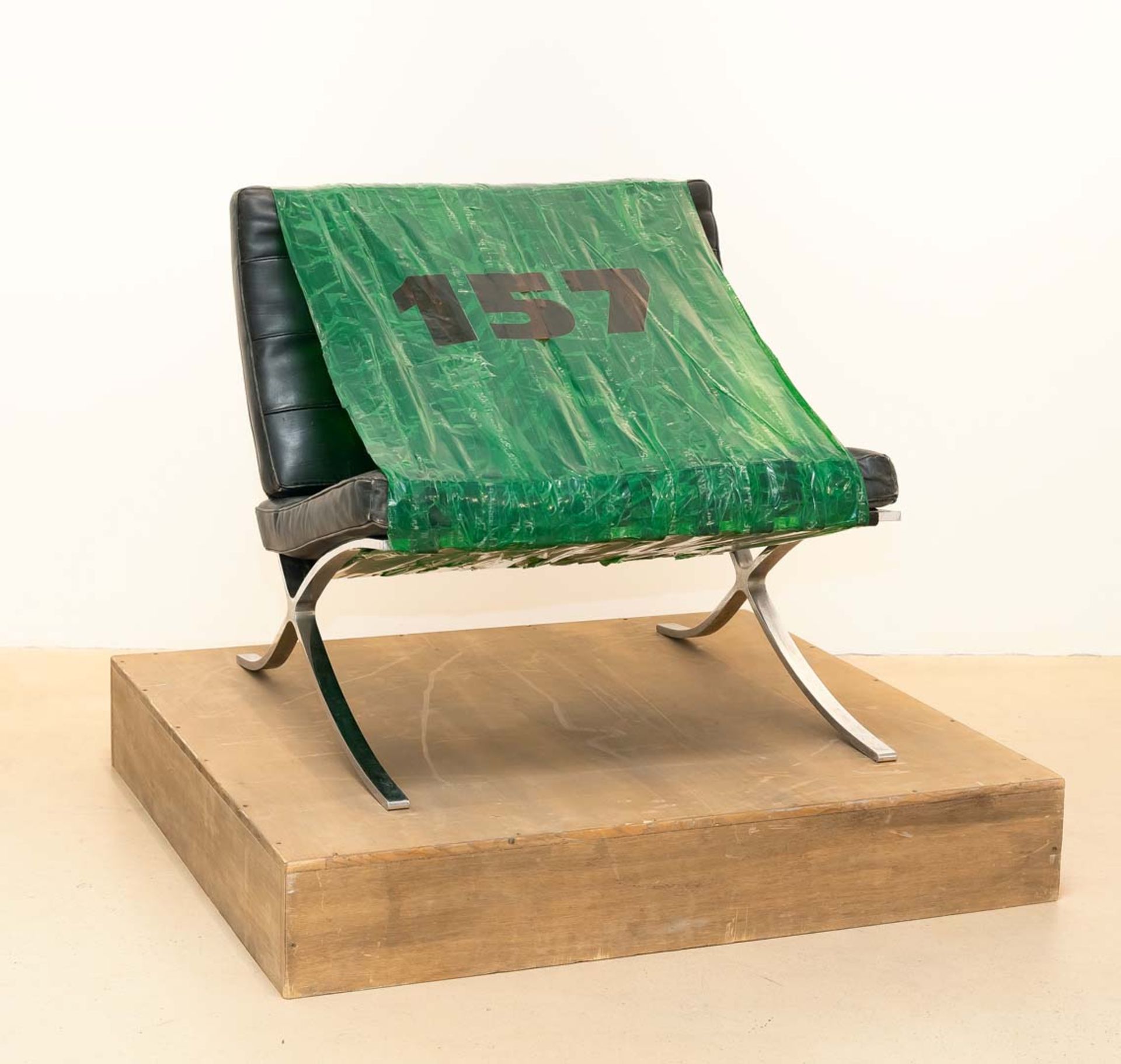 Martin Kippenberger, Untitled (157).Barcelona chair, sticky tape, foil script on wooden plinth. (