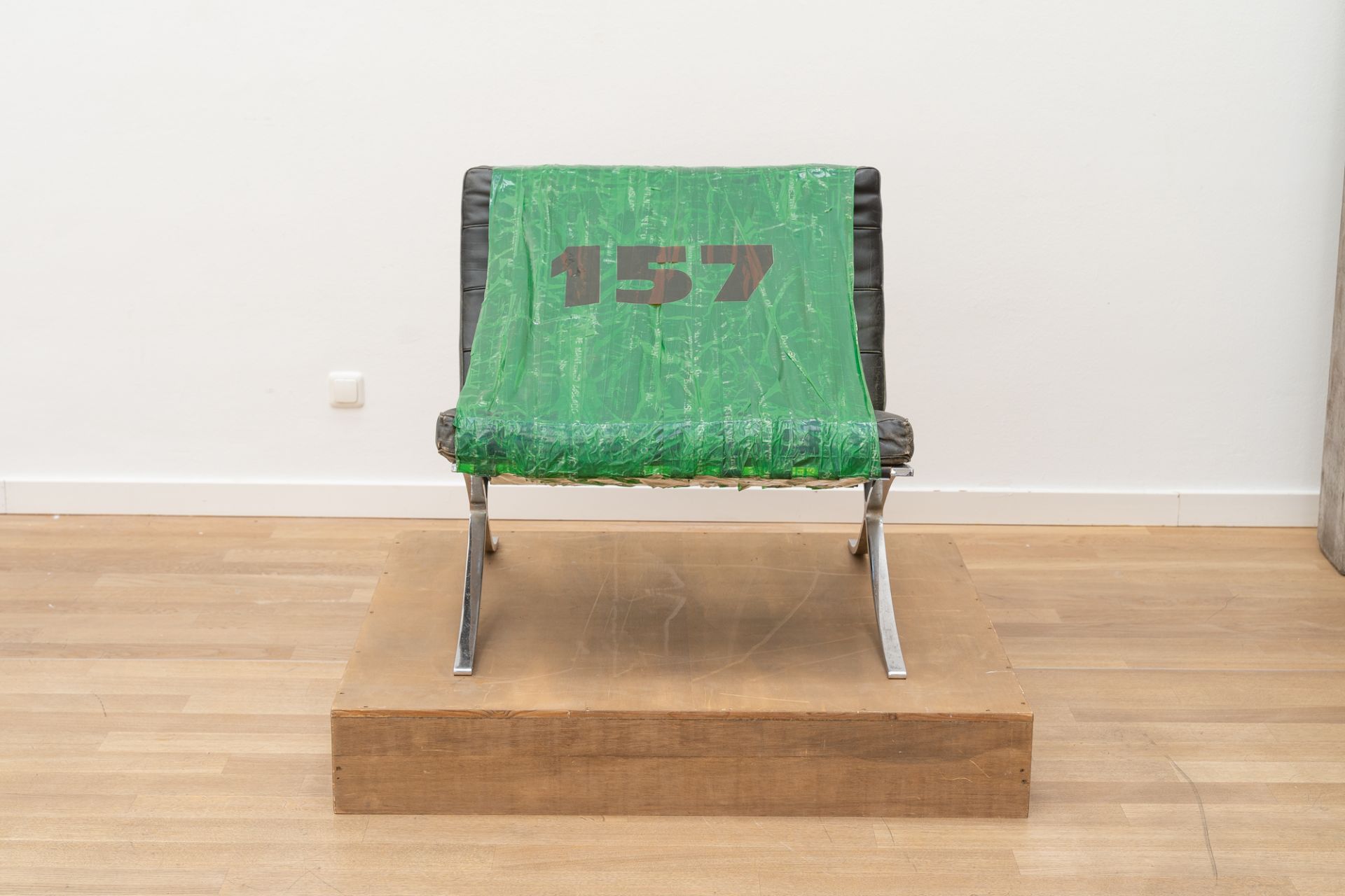 Martin Kippenberger, Untitled (157).Barcelona chair, sticky tape, foil script on wooden plinth. ( - Image 2 of 5