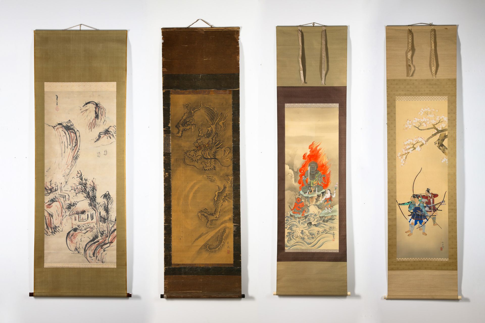 4 scroll paintings: landscape, dragon, figure in fire, warriors with bows (63, 136, 115, 96)