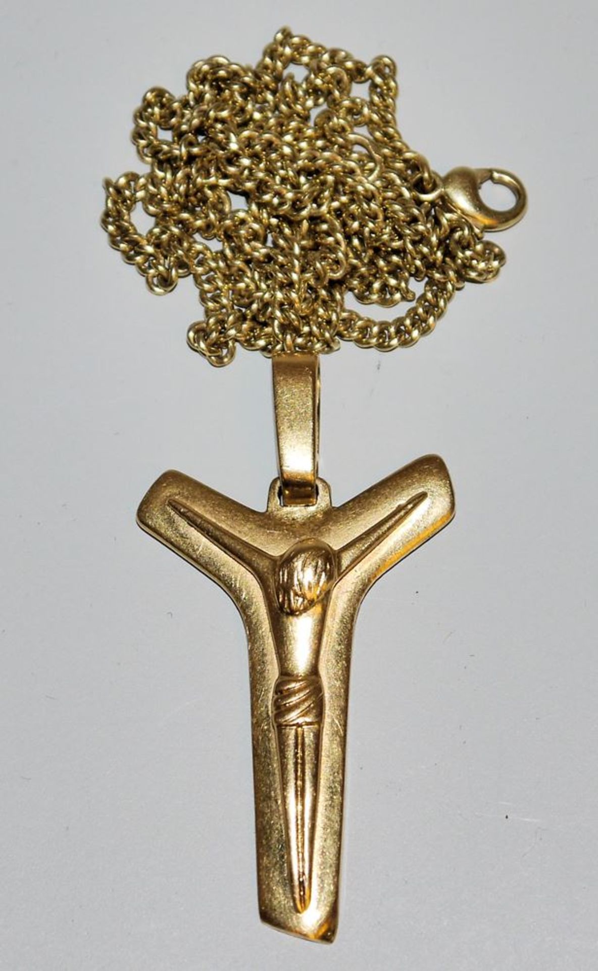 Crucifix pendant on chain, gold