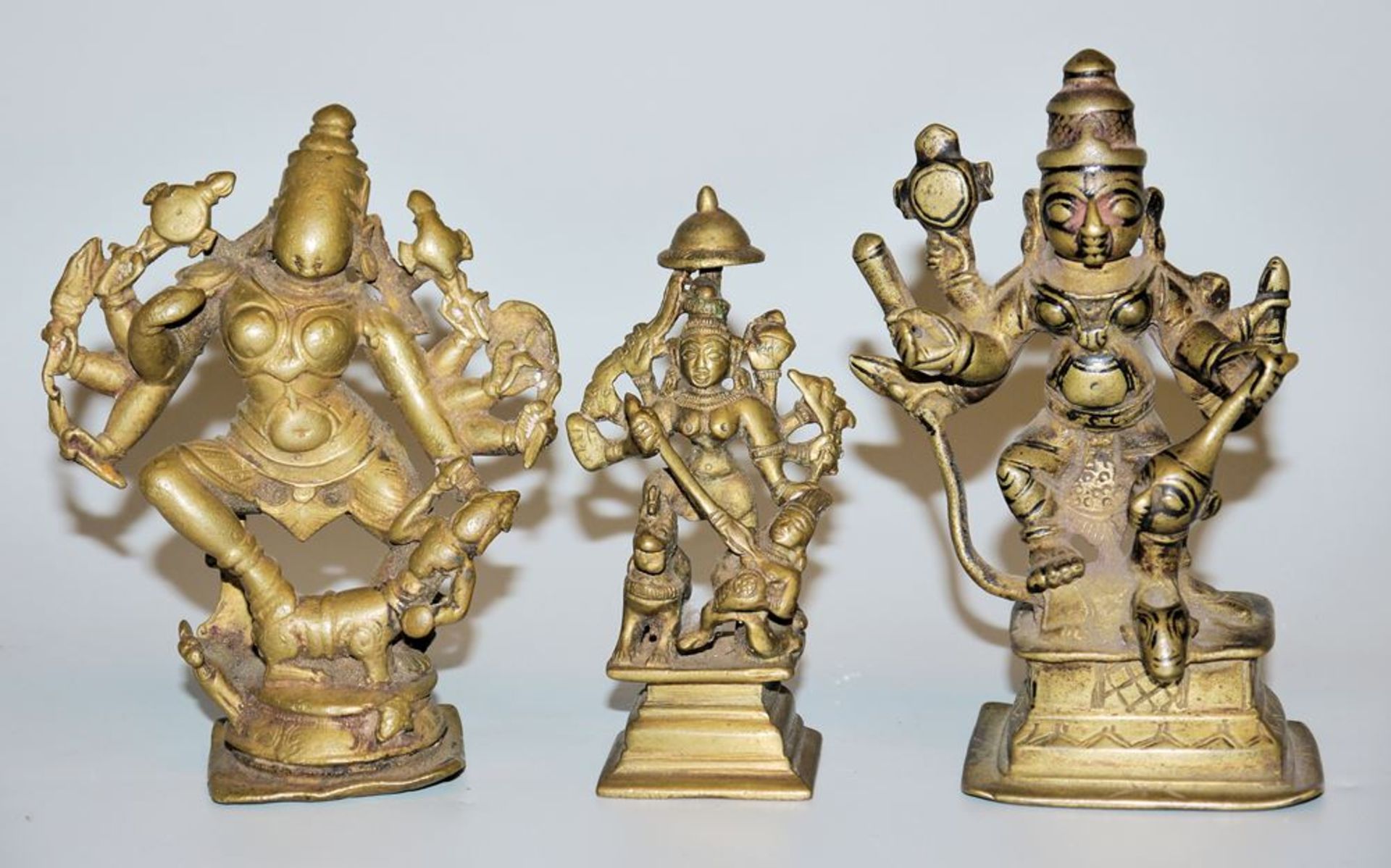 The goddess Durga as slayer of the buffalo demon, three brass bronzes from Maharashtra/Karnataka, I