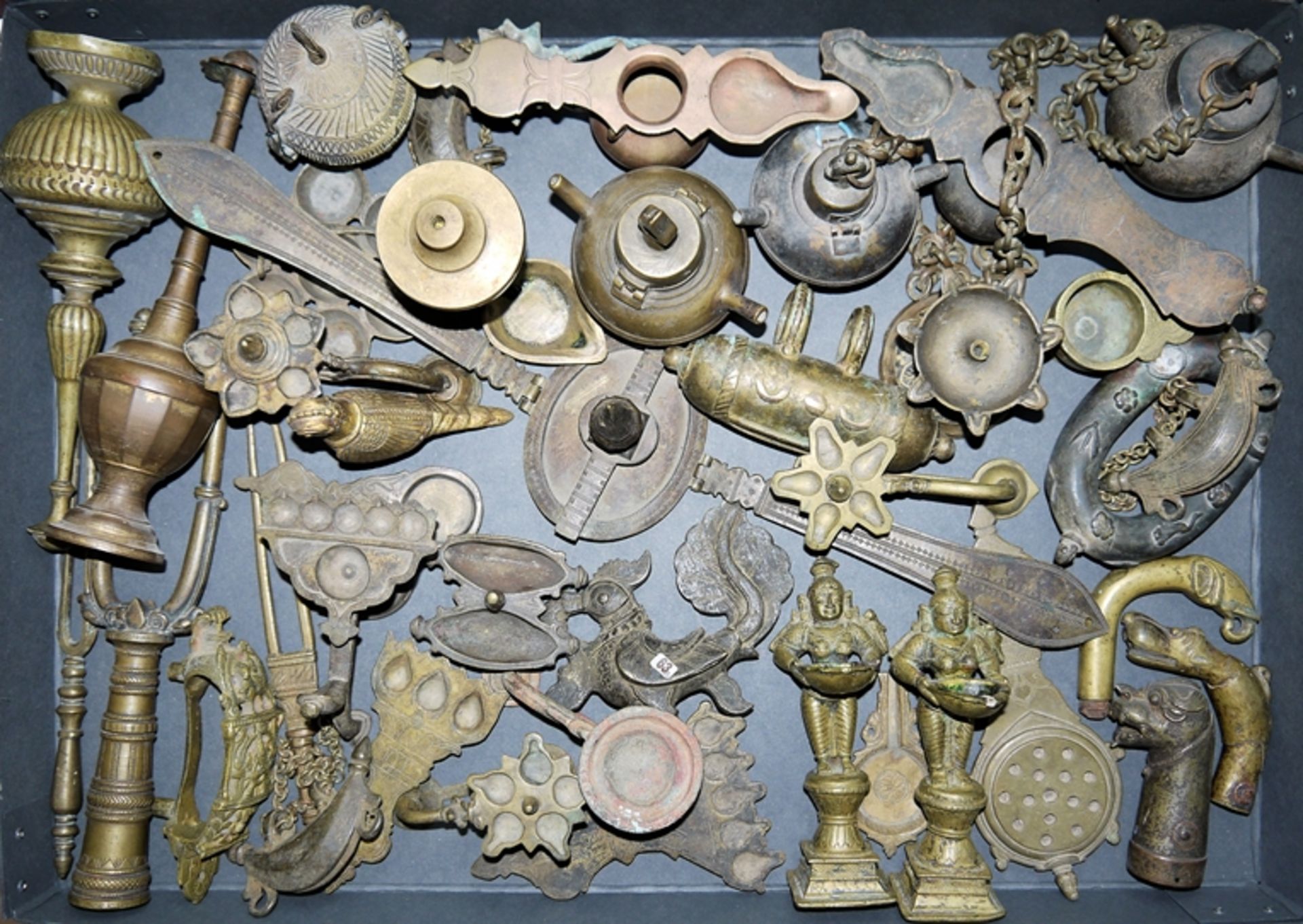 Large collection of ritual lamps and ornamental pieces of cast brass, India 18th & 19th c.