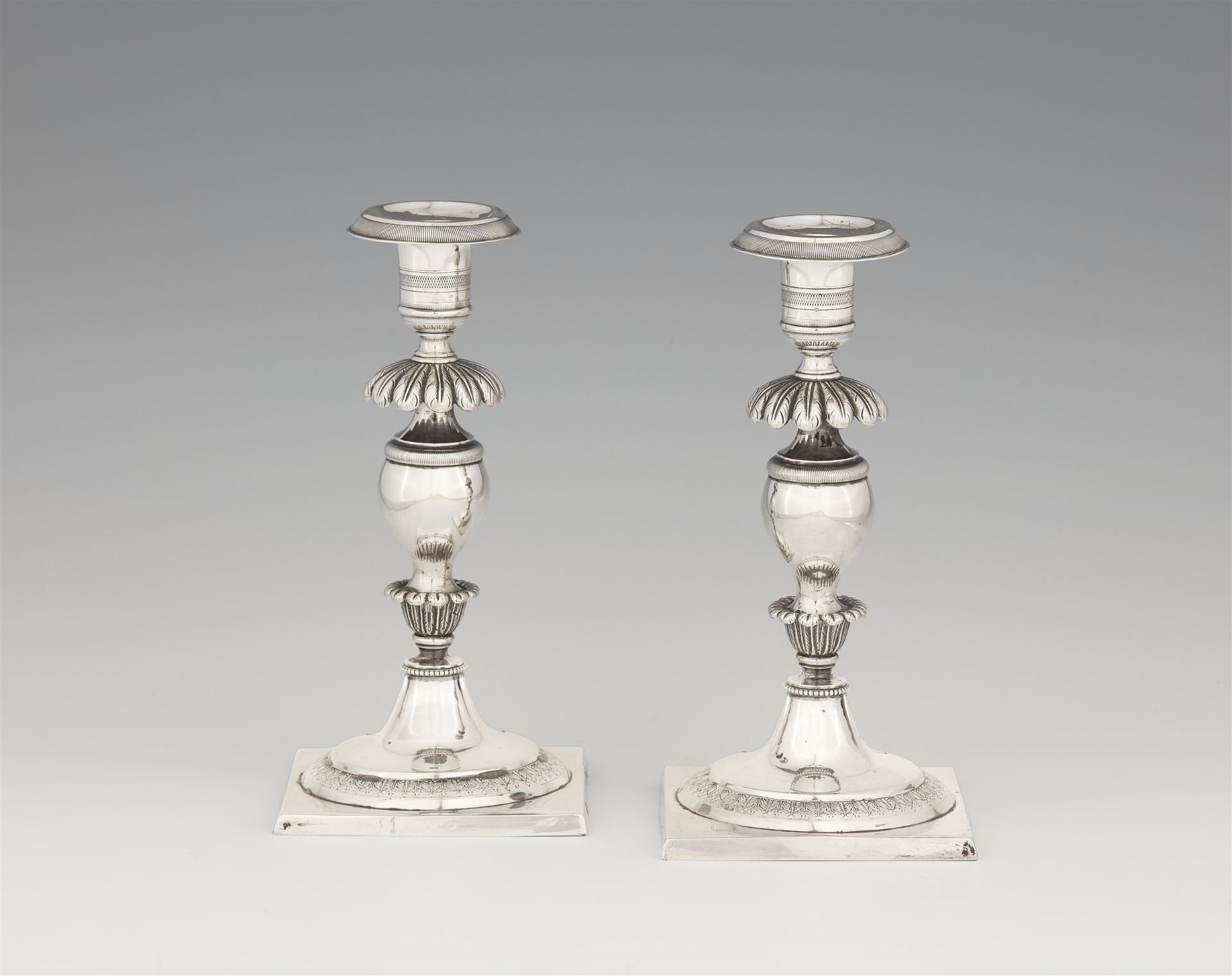 A pair of small Berlin silver candlesticks