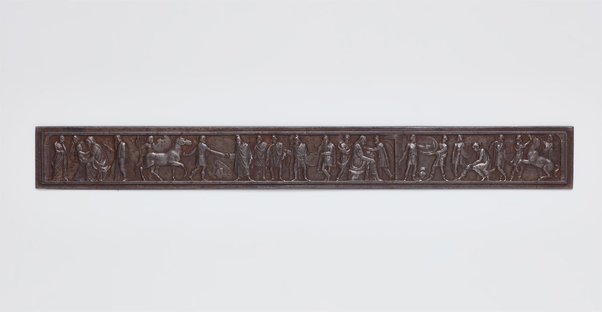 A rare cast iron ruler with Classical frieze motifs