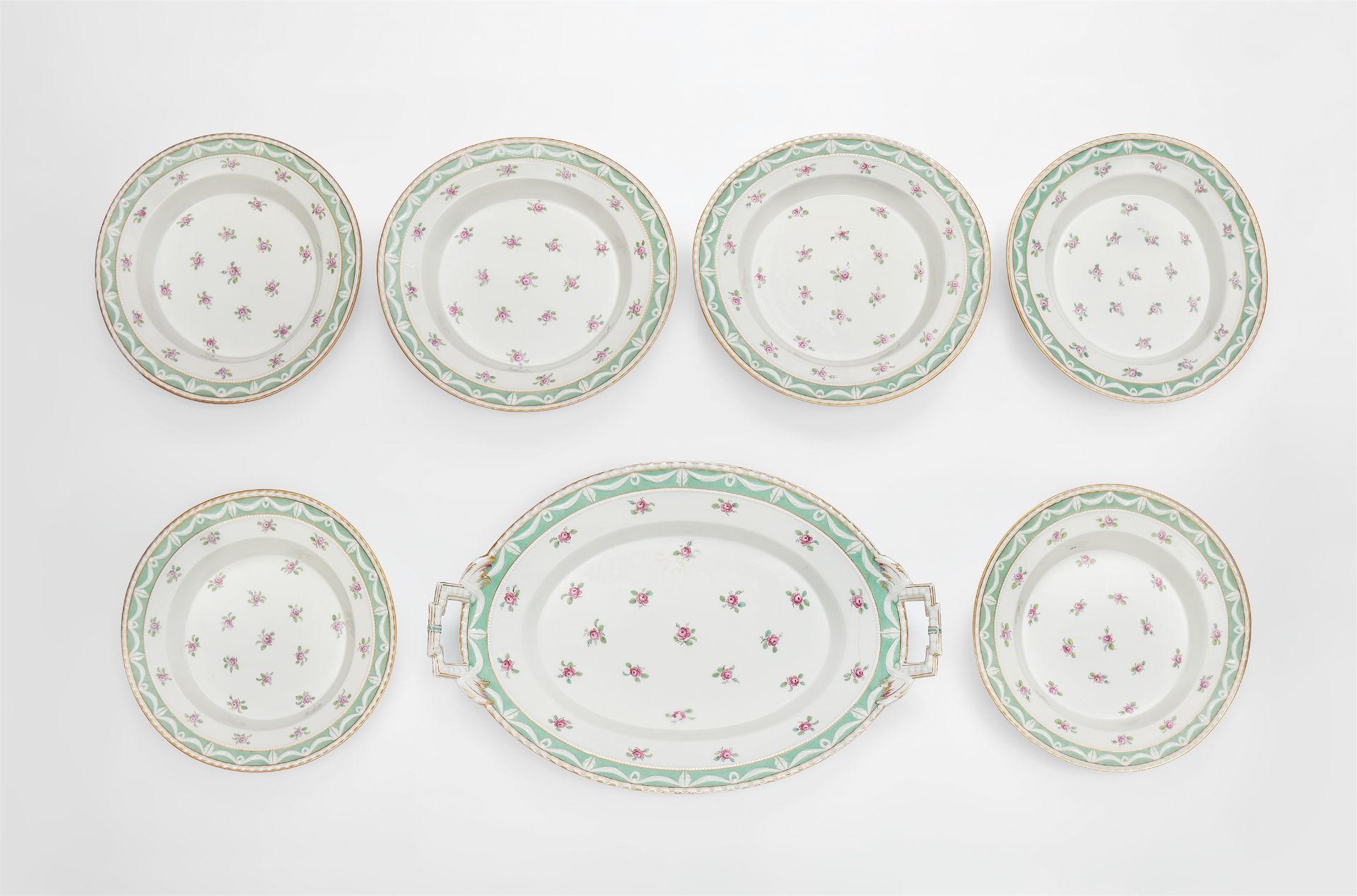 Six dishes and an oval platter from the dinner service with roses for the wedding of Princess August
