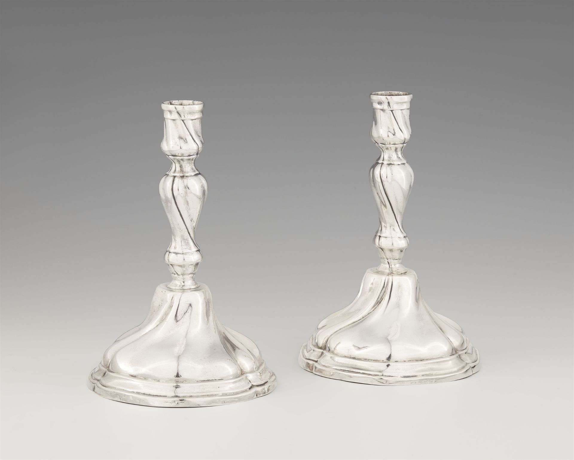 A pair of late Baroque Berlin silver candlesticks