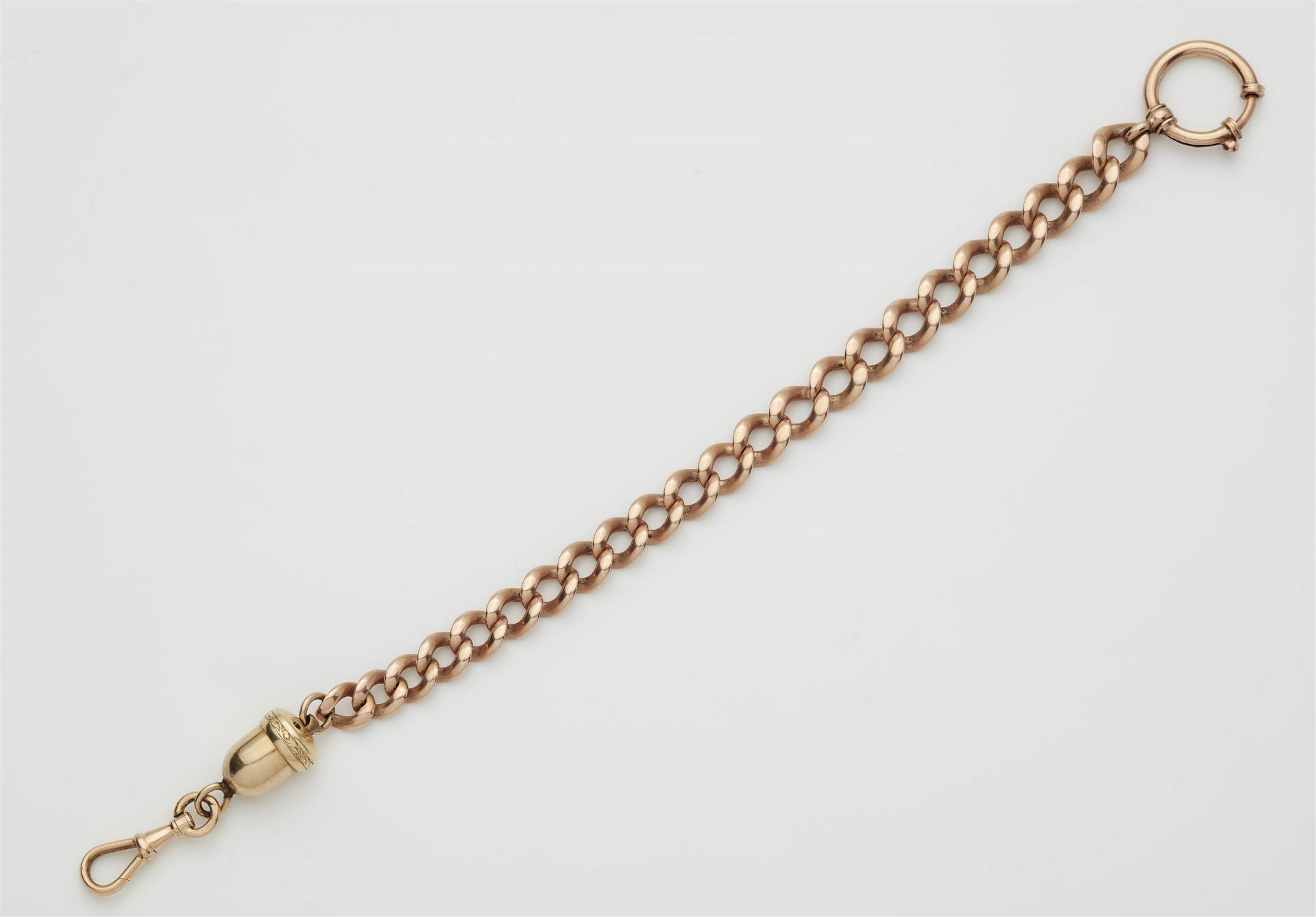 An 14k yellow and rose gold watch chain with anti-theft device