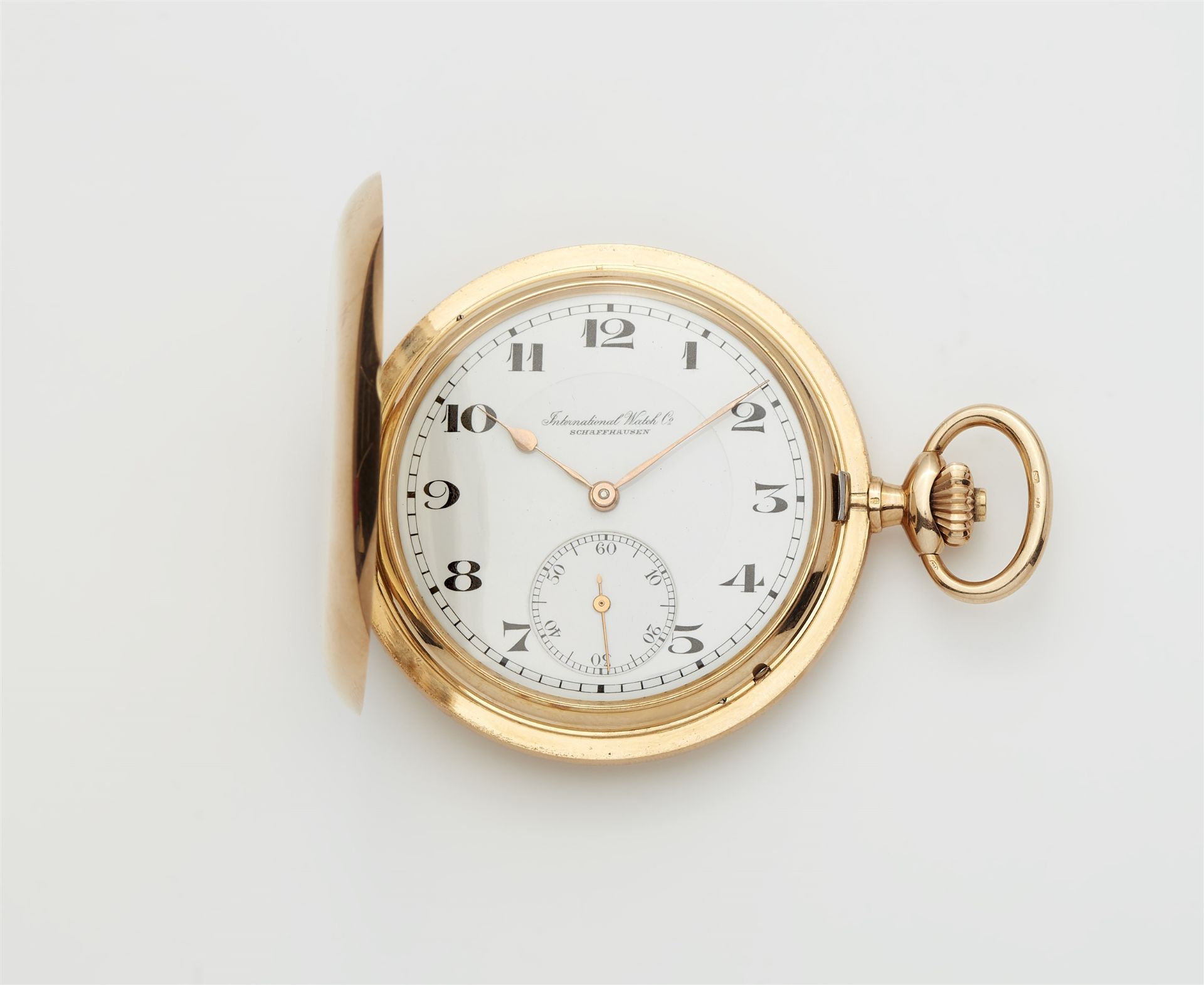 An IWC 14k yellow gold manual winding savonette pocket watch.