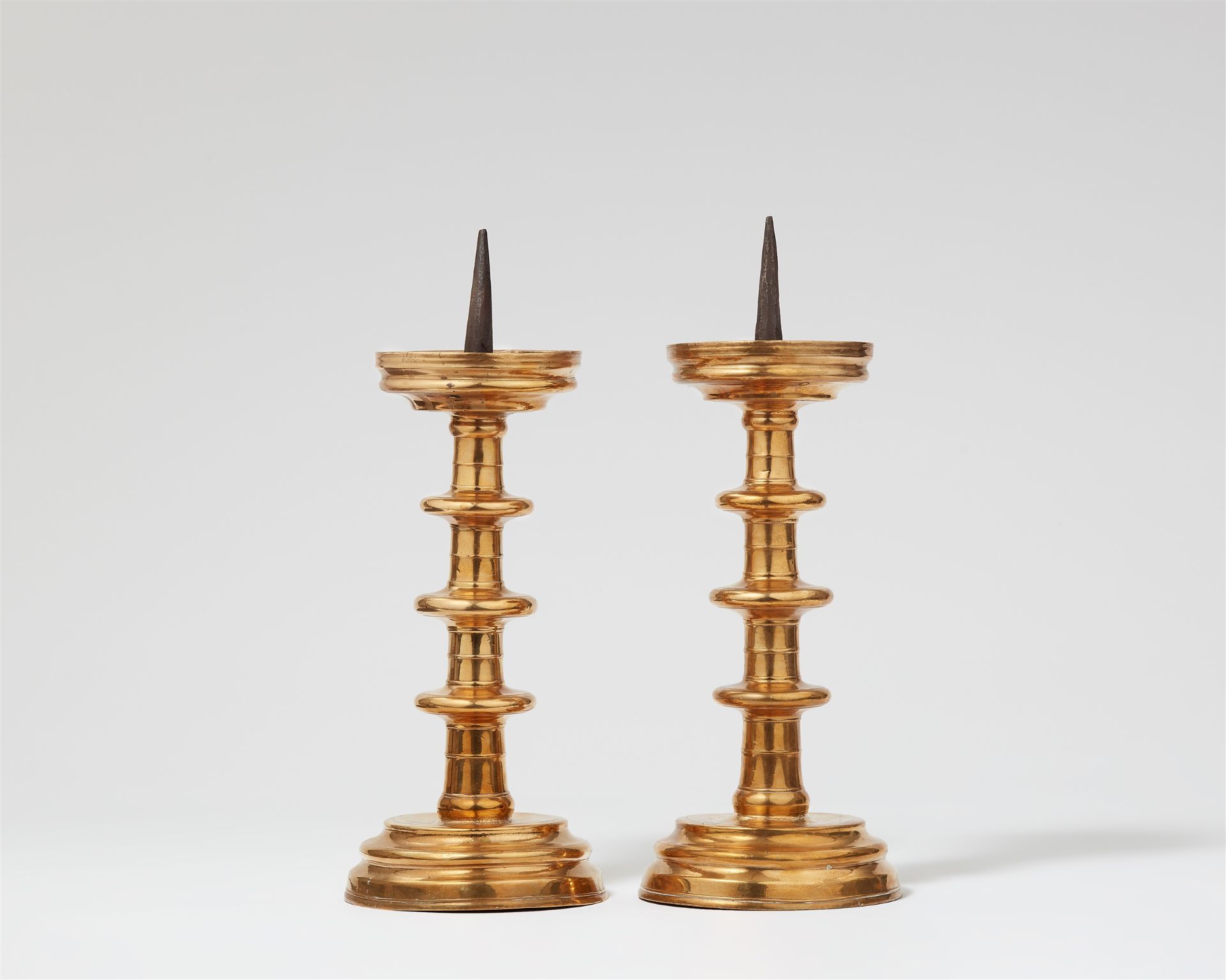 A pair of metal candlesticks