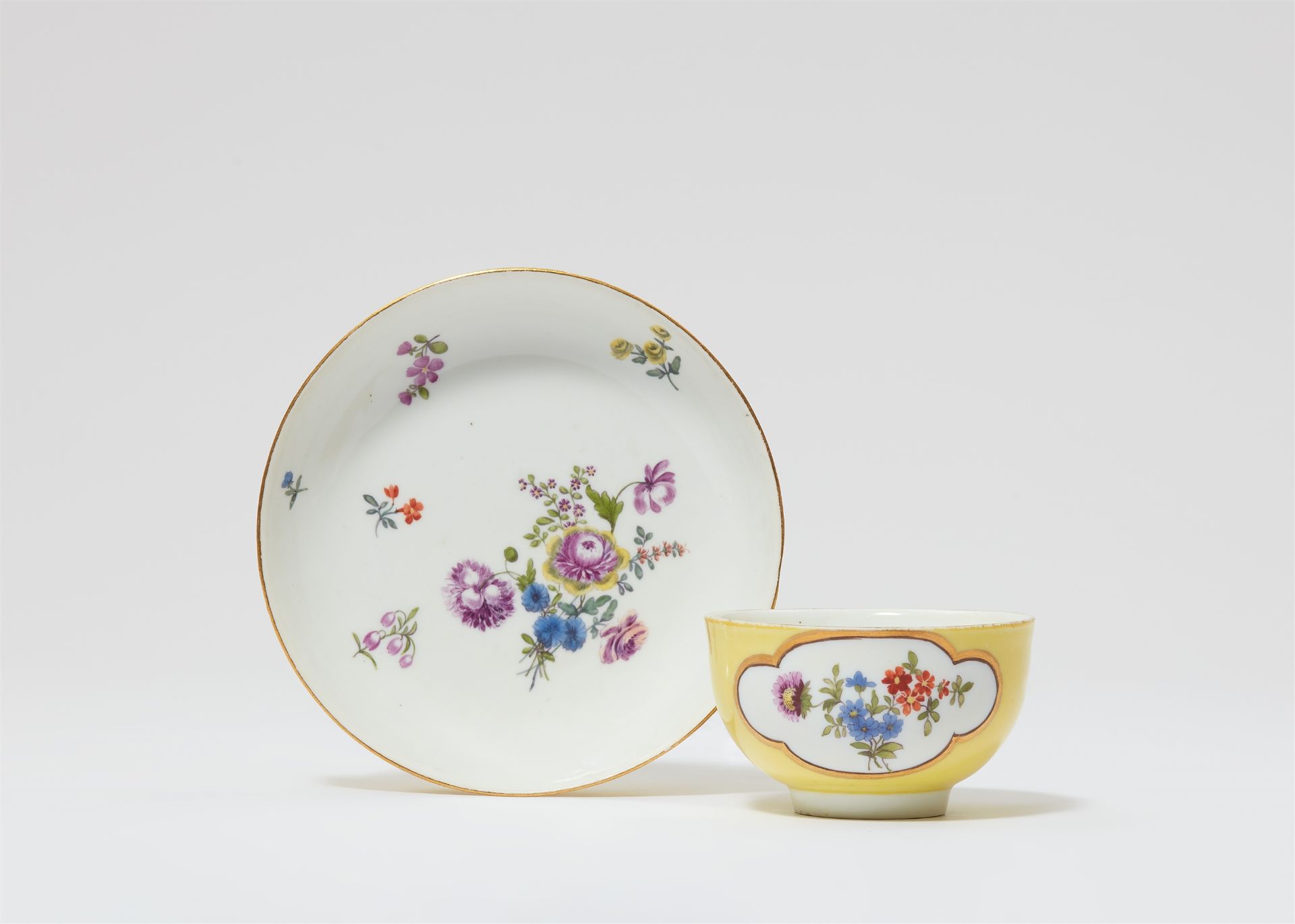 A Meissen porcelain teabowl and saucer with yellow ground